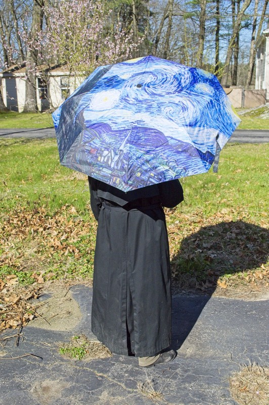 picture of me showing off my new umbrella despite full sunshine