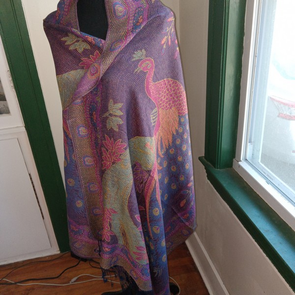 rich colors pick out the peacock design.